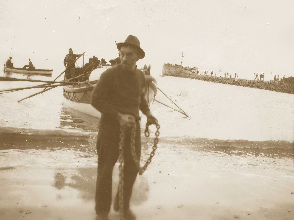 W T Toms with Ryder coming ashore in background